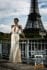 Fashion editorial of a model in a Swarovski crystal gown posing by the Eiffel Tower, captured by Rich Cirminello, Dallas fashion photographer, and winner of the Portrait Masters Bronze Award.