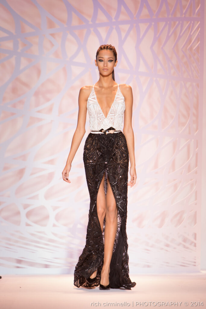Model in a black and white Zuhair Murad gown with deep plunge at Paris Haute Couture Fashion Week 2014, photographed by Rich Cirminello.