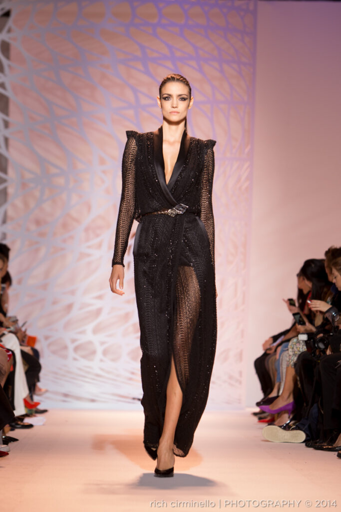Model in a sheer black Zuhair Murad gown with sequins at Paris Haute Couture Fashion Week 2014, photographed by Rich Cirminello