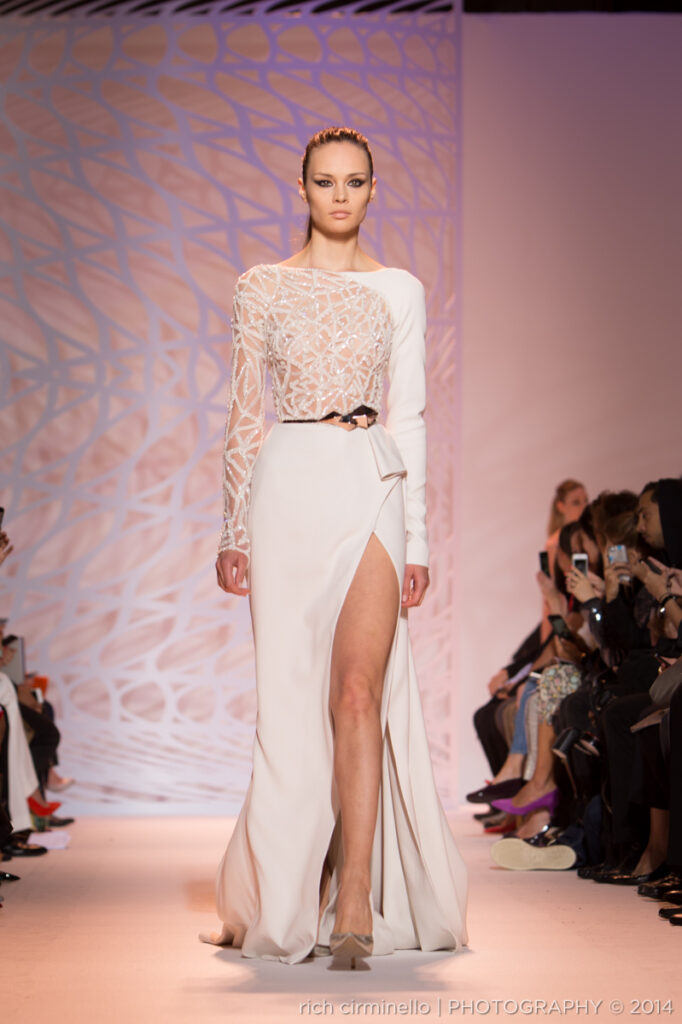 Model in a white Zuhair Murad gown with geometric beaded top at Paris Haute Couture Fashion Week 2014, photographed by Rich Cirminello