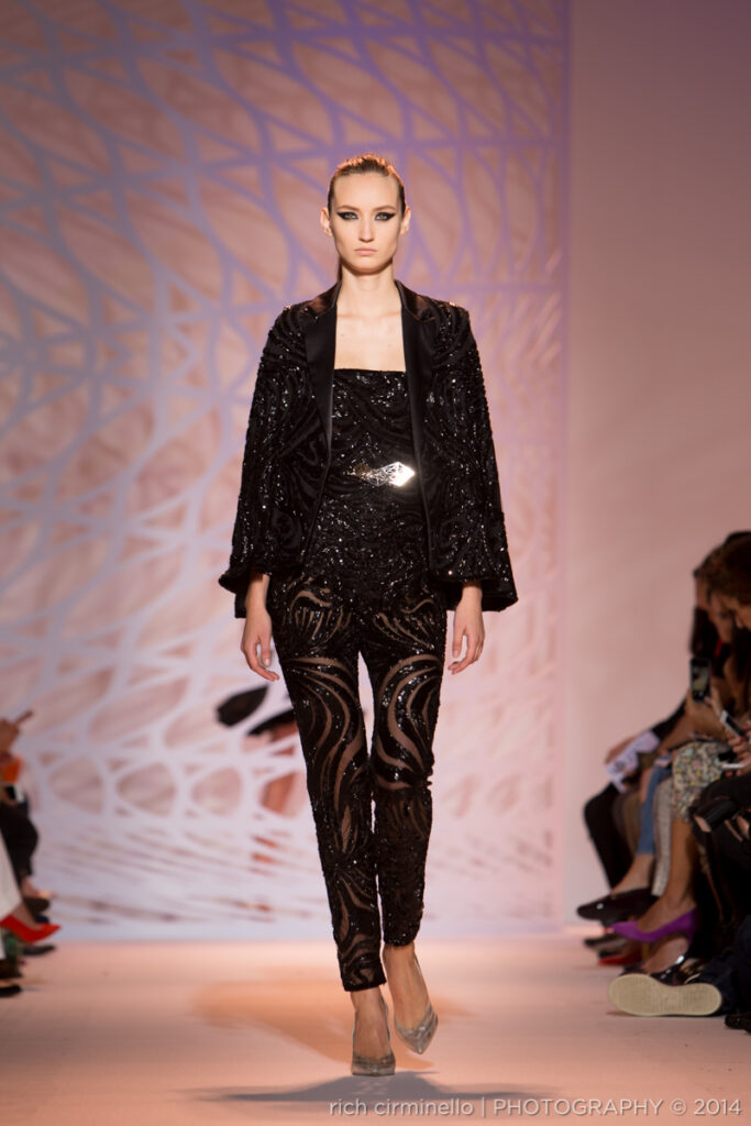 Model in a black Zuhair Murad sequin jumpsuit at Paris Haute Couture Fashion Week 2014, photographed by Rich Cirminello