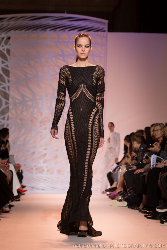 Model in a black Zuhair Murad gown with geometric detailing at Paris Haute Couture Fashion Week 2014, photographed by Rich Cirminello.