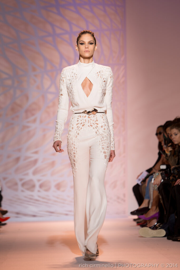 Model wearing a white Zuhair Murad jumpsuit at Paris Haute Couture Fashion Week 2014, photographed by Rich Cirminello