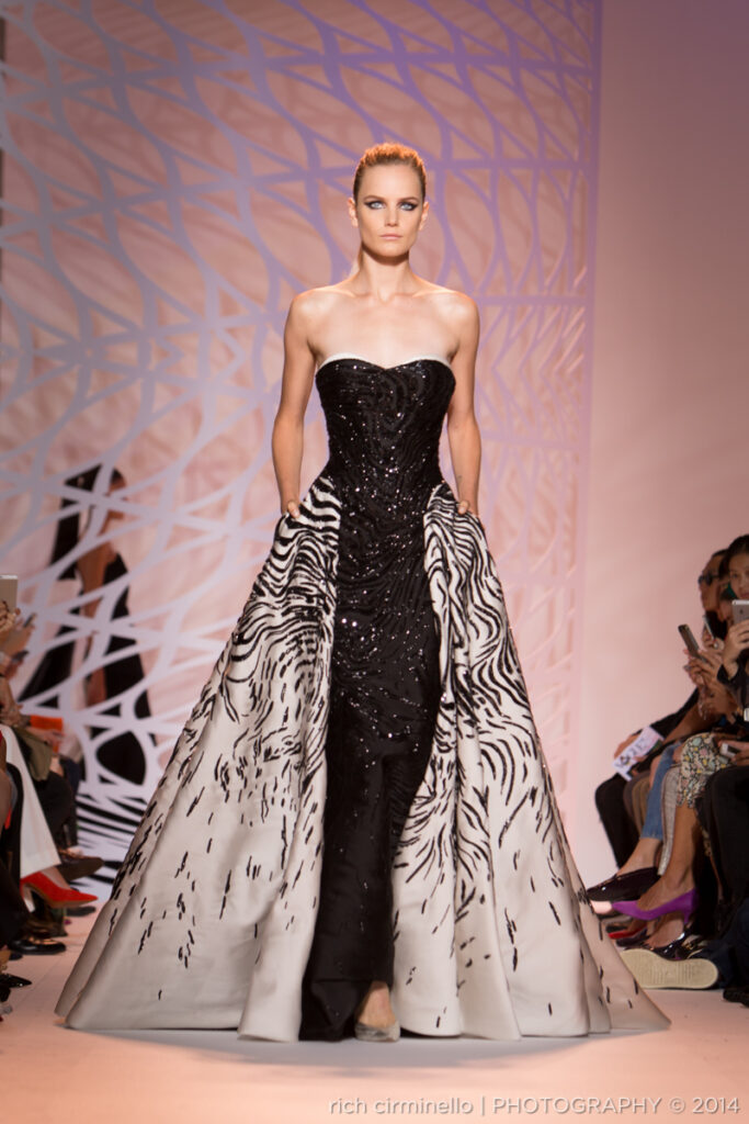 Model wearing a black gown with white detailing by Zuhair Murad at Paris Haute Couture Fashion Week 2014, photographed by Rich Cirminello