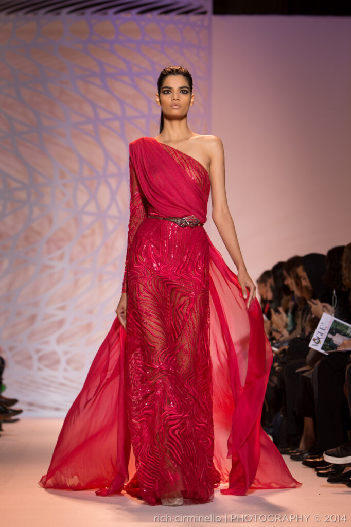 Model presenting a one-shoulder fuchsia Zuhair Murad gown at Paris Haute Couture Fashion Week 2014, photographed by Rich Cirminello.