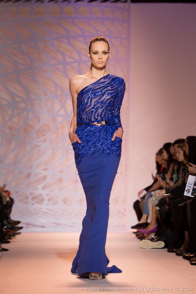 Model wearing a Zuhair Murad one-shoulder sequined gown at Paris Haute Couture Fashion Week 2014, captured by Rich Cirminello.