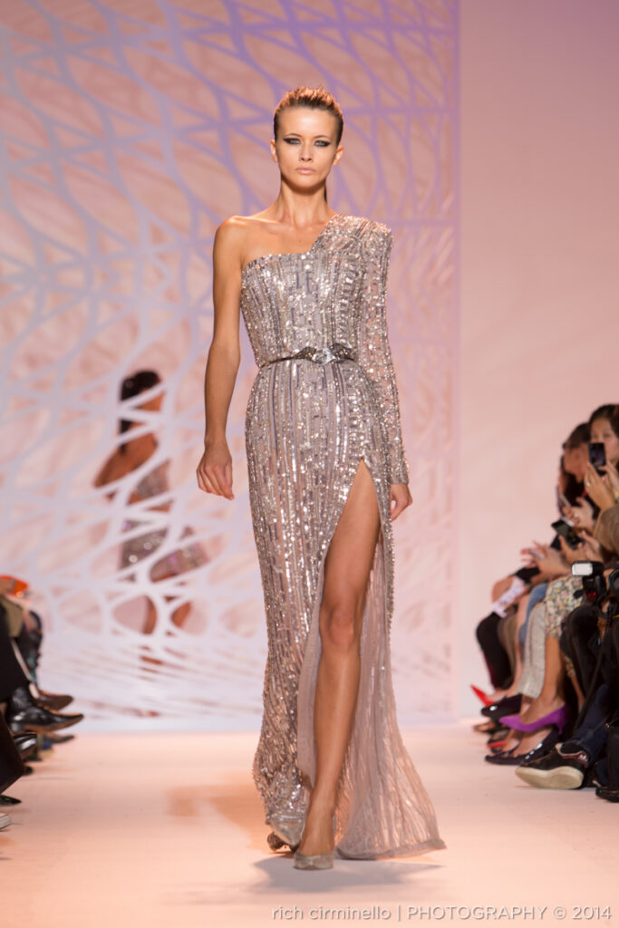 Model in a one-shoulder silver gown with a high slit at Zuhair Murad’s 2014 Paris Haute Couture Fashion Week, photographed by Rich Cirminello.