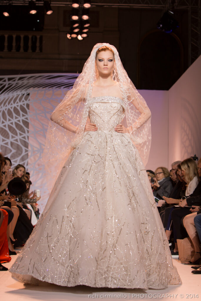 Model showcasing a Zuhair Murad wedding gown at Paris Haute Couture Fashion Week 2014, captured by Rich Cirminello.