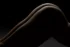 Edge of light tracing the curve of a body, Dallas bodyscape