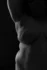 Black and white male torso study in low light, fine art body photography