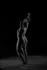 Silhouette with raised arm, black and white bodyscape