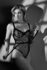 Black and white boudoir portrait in window-light shadows, Dallas