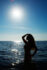 Destination boudoir silhouette in the sea at Red Beach, Santorini